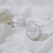 Load image into Gallery viewer, Flat lay of sample sea salt lavender tin body scrub with neutral background
