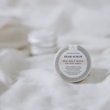 Load image into Gallery viewer, Flat lay of sample sea salt rose tin body scrub with neutral background
